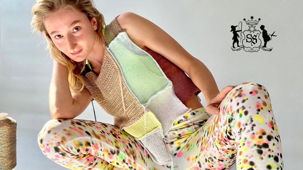 knitted top made from assorted patches.  handpainted leggings with multicolor sprinkle dots.