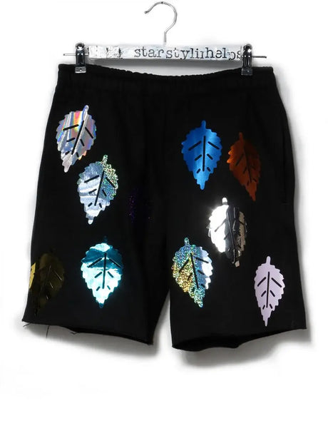 Black shorts with shiny colorful leaf appliqués, unique hand-printed Berlin fashion
