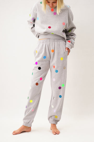 Grey joggers printed with colorful small polka dots