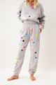 Grey joggers printed with colorful small polka dots