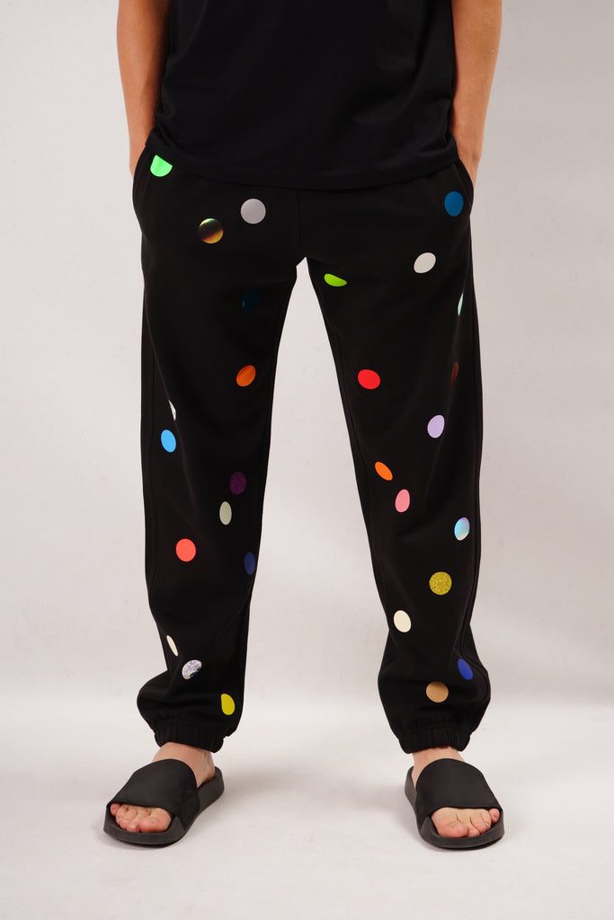 Black joggers printed with colorful small polka dots