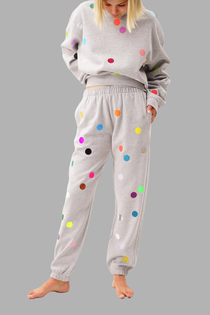 Grey joggers printed with colorful small polka dots