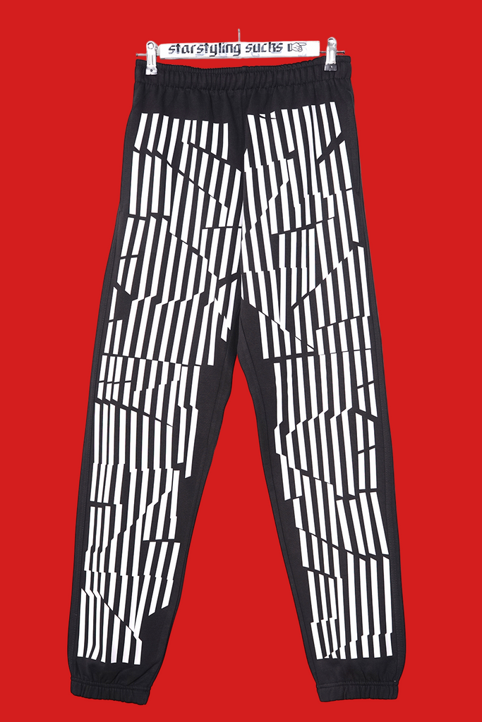 black joggers with stripe print on front and back