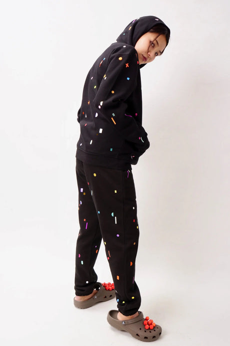 black track suit with multicolor applications allover