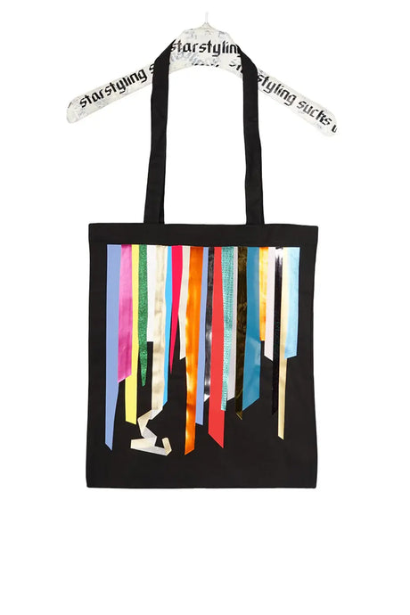 Black tote bag with colorful metallic foil stripes and long handles