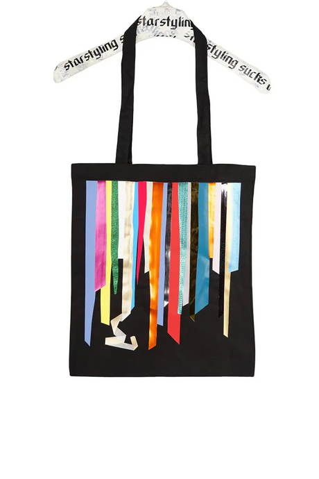 Black tote bag with colorful metallic foil stripes and long handles