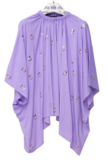 Lavender oversized blouse with gold smiley face print and flowy sleeves on hanger