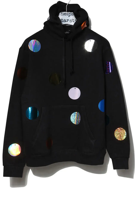 Black hoodie with colorful holographic polka dots and a front pocket, hanging on hanger