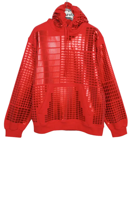 Red hoodie with shiny geometric grid print and kangaroo pocket, hanging on a hanger