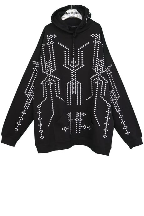 Black oversized hoodie with white geometric dot pattern and front pocket