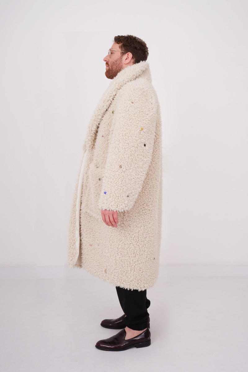 Teddy coat in creme color with stones and funny charms sewn allover