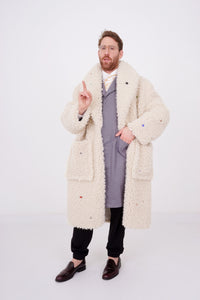 Teddy coat in creme color with colorful stones and funny buttons sewn allover
